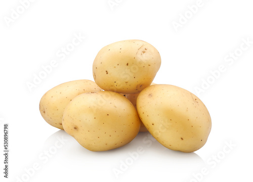 Raw whole potatoes close up isolated on white background