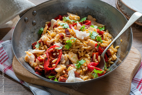 Cod, chorizo and orzo pasta with roasted red peppers
