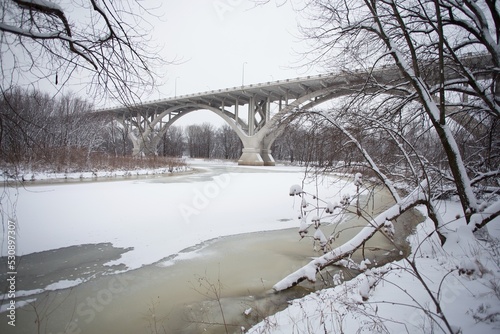 The Mendota Bridge and Minnesota River in Mendota Heights, Minnesota, in winter time, as seen from Pike Island in Fort Snelling State Park. photo