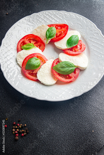 caprese saladmozzarella basil tomato fresh dish healthy meal food snack on the table copy space food background  