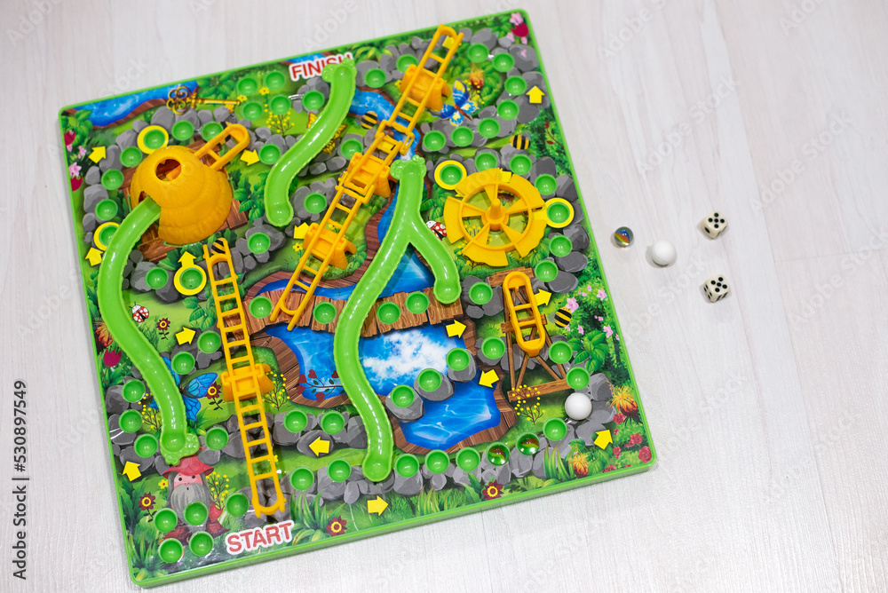 Obraz premium Board game with number cubes on white background