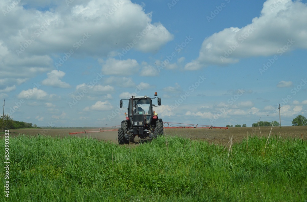 farmer with a tractor in the field