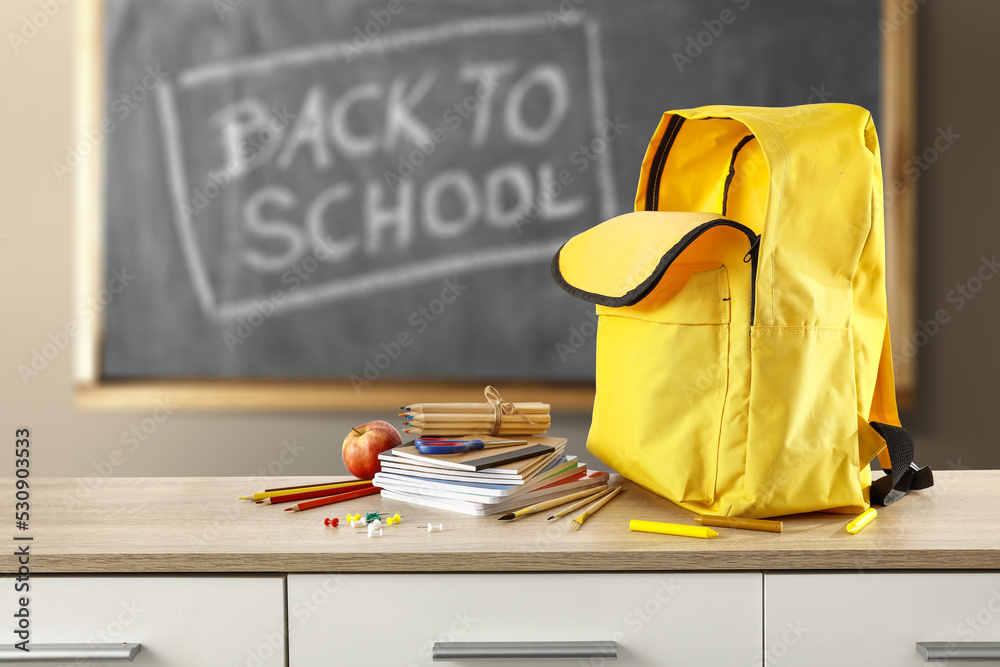 Desk of free space and school backpack Desk of free space and school backpack