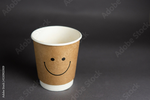 paper cup for coffee on a black background