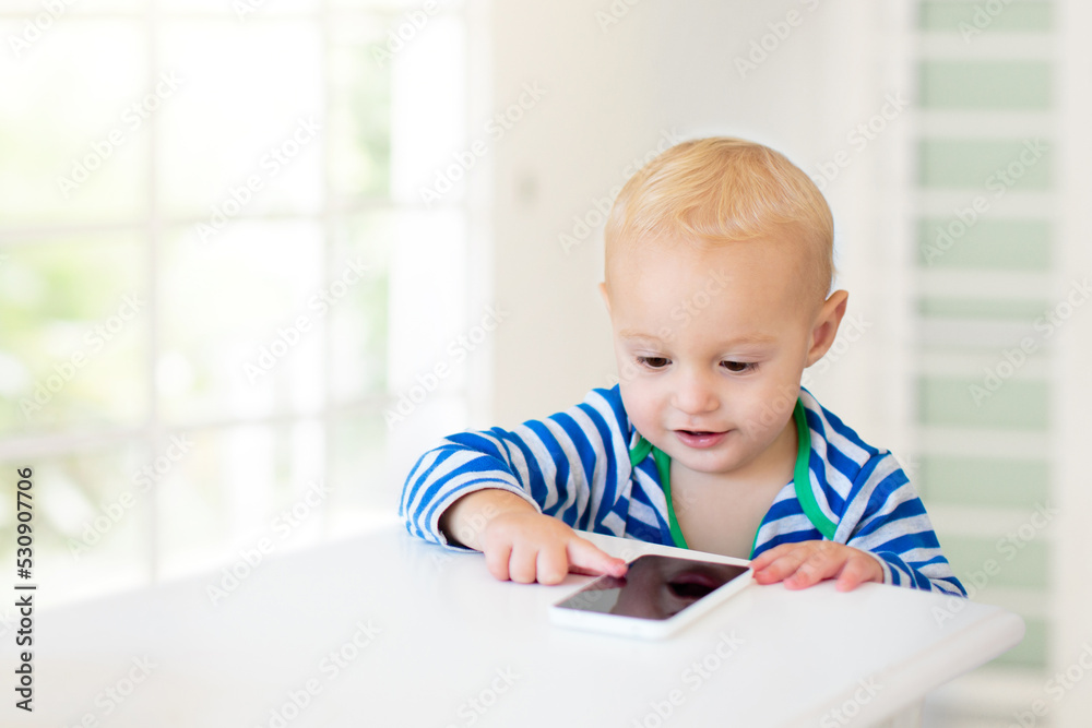 Baby boy with mobile phone
