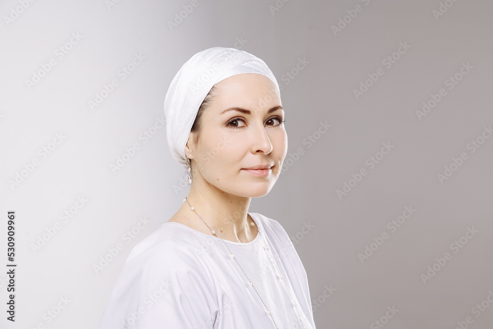 beautiful girl doing yoga in light clothes in white yoga studio beautiful girl doing yoga in light clothes in white yoga studio