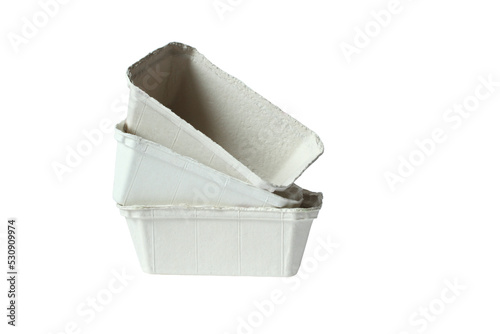 Biodegradable food trays made from pressed cardboard isolated on white background. Closeup