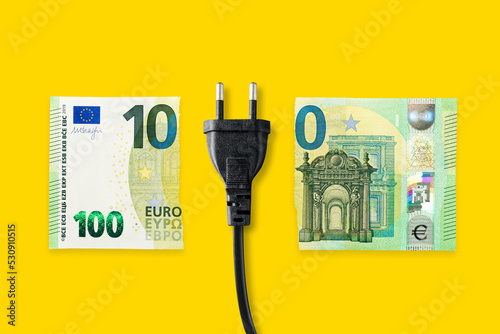 Euro banknote on a yellow background. Energy crisis and expensive electricity, gas price. Big heating, gas and electricity bill