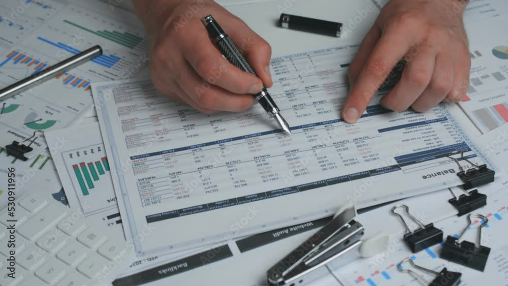 Businessman working With Documents And Financial Report On Table Businessman working With Documents And Financial Report On Table