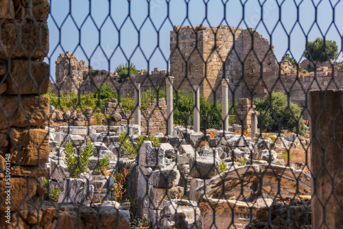 
View of the ruins of the monumental ancient Roman castle and agora in the historic part of Antique Side, in Antalya, Turkey
