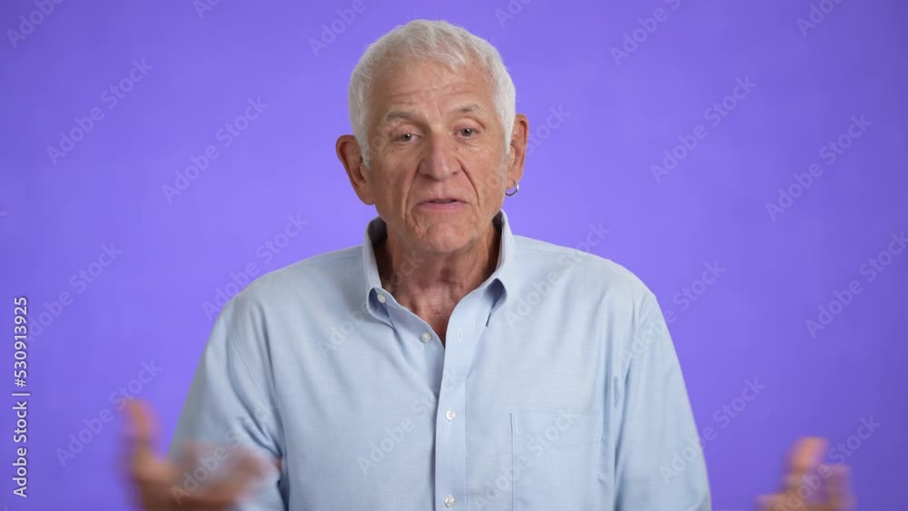 Sad upset worried disturb displeased shocked elderly gray-haired man 70s talking wears blue shirt sigh surprise put hands on face isolated on solid purple background studio portrait Sad upset worried disturb displeased shocked elderly gray-haired man 70s talking wears blue shirt sigh surprise put hands on face isolated on solid purple background studio portrait