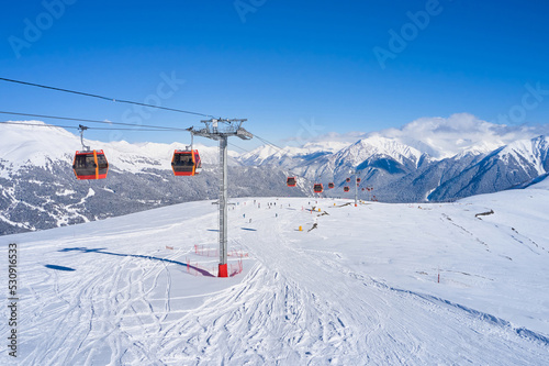 Ski lift in the snowy mountains of Arkhyz resort city in Russia