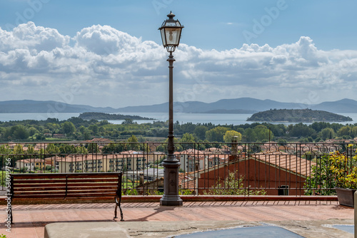 Panoramic view of Lake Trasimeno from a terrace in the historic center of Tuoro sul Trasimeno, Perugia, Italy photo