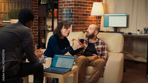 Canvas Print Wife having proof that husband cheated on smartphone, showing text messages and being caught with adultery