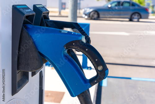 Electric car charger at a gas station. ecological mobility