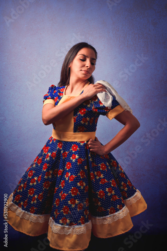 young chilean woman with national dress or folk costume and headscarf to celebrate national holidays portrait photo