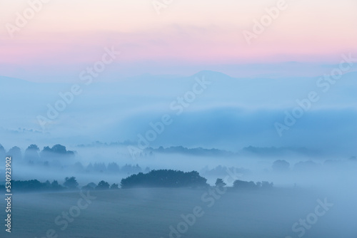 Morning view of Bystricka village shrouded in fog, Slovakia. © Cavan