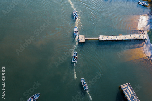 Fisherman in boats starting a fishing tournament at Tims Ford Bass Club in Winchester Tennessee. photo