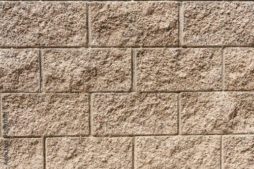 Clouse up of textured beige cinder block wall