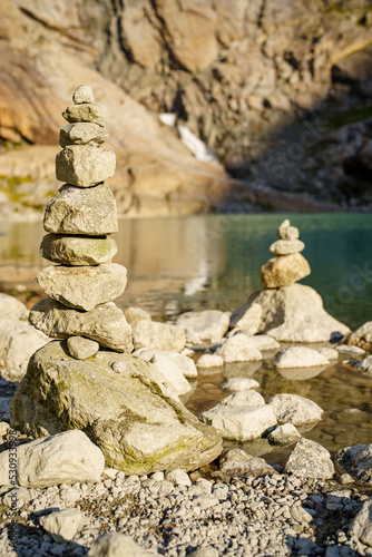 Rock stacking in Norway blurry bokeh background