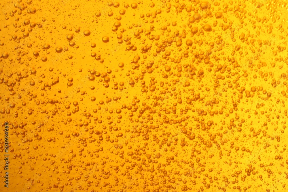 Tasty beer with bubbles as background, closeup Tasty beer with bubbles as background, closeup