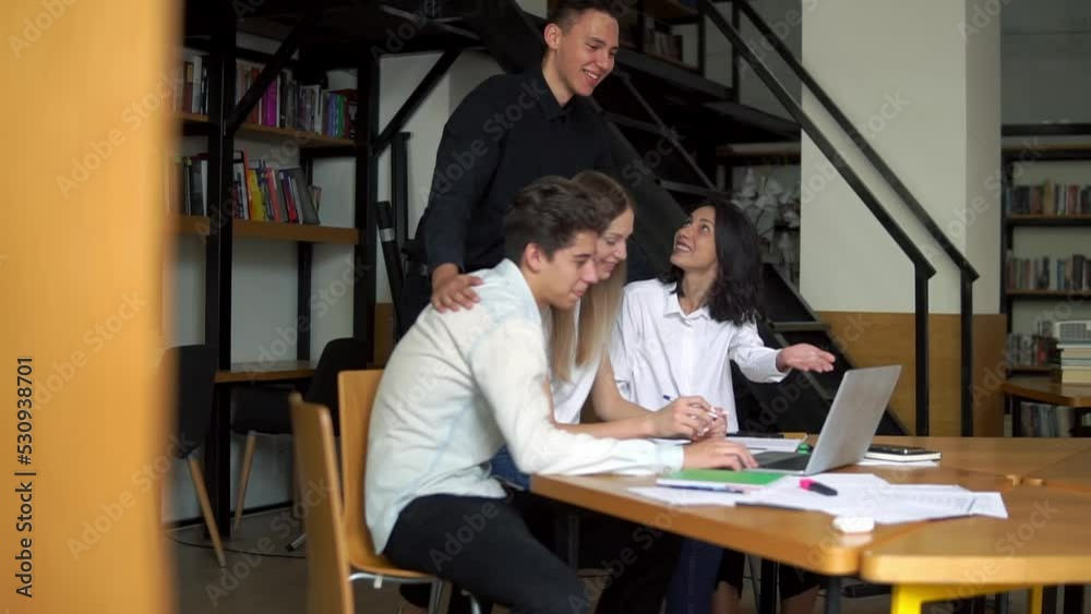 Motivated group enjoys success. The young team is planning together