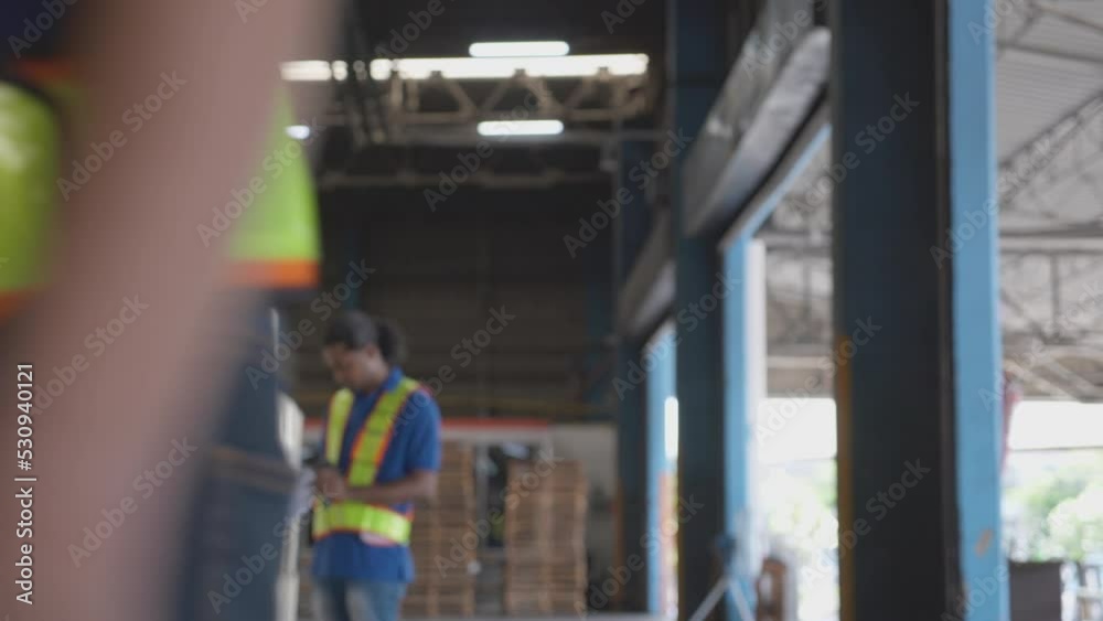 Young asian man doing agreement together and handshake with success in the warehouse at factory, supervisor man and employee shaking hands with congratulations at storehouse, logistic and freight.