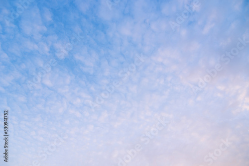 Blue sky background with white clouds. © samurai