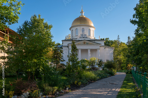 View of the St. Michael's Cathedral of the Holy Dormition Pskov-Pechersk Monastery on a sunny summer day, Pechora, Pskov region, Russia