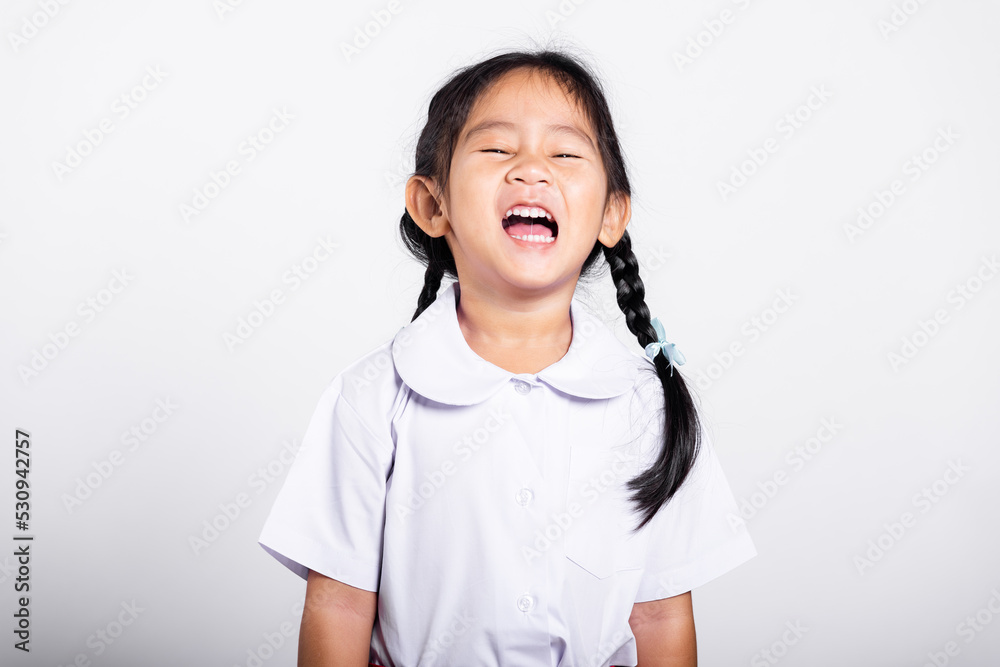 Asian adorable toddler smiling happy wearing student thai uniform red skirt standing in studio shot isolated on white background, Portrait little children girl preschool, Happy child Back to school Asian adorable toddler smiling happy wearing student thai uniform red skirt standing in studio shot isolated on white background, Portrait little children girl preschool, Happy child Back to school