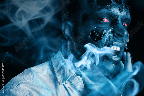 Scary zombie on dark background with smoke