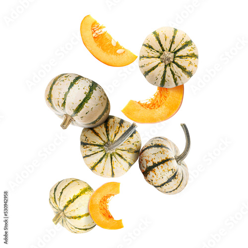 Many flying pumpkins isolated on white