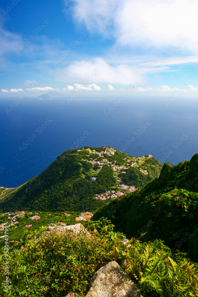 Aerial view of Windwardside village from the Mount Scenery volcano on the Caribbean island of Saba in the Netherlands Antilles. Vertical view.