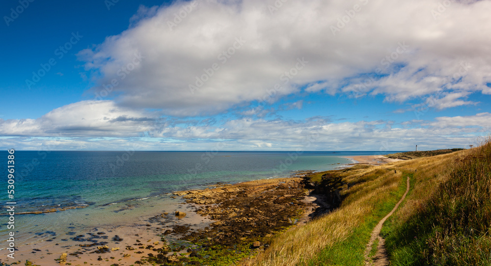 Covesea Skerries Lighthouse on the empty beach