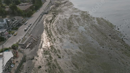 Aerial flyover of muddy beaches with small water rivulets throughout in Alki Point Seattle, Washington. photo