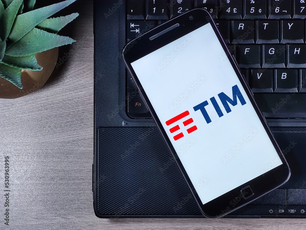TIM logo on the smartphone screen. TIM (acronym for Telecom Italia Mobile)  is a cell phone company based in Italy, also active in Brazil. Stock Photo  | Adobe Stock