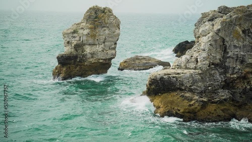 slow motion of waves crashing into rocky cliff seascape paradise Black Sea Bulgaria  photo