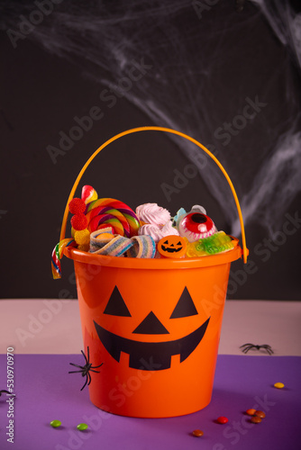 Halloween Jack o Lantern orange bucket with candy photo