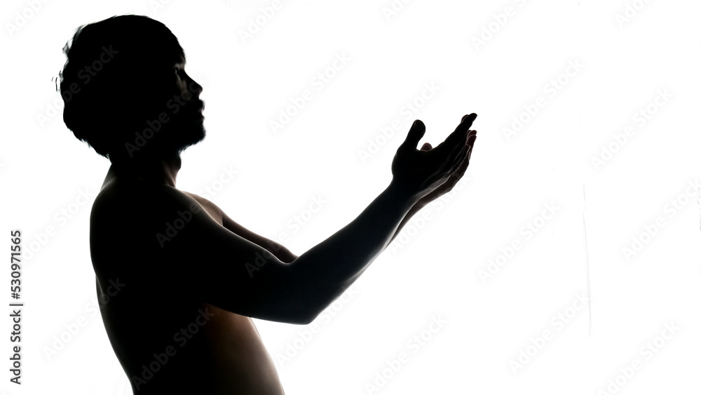 Silhouette of a praying man on a white background. Used in a Thanksgiving project.