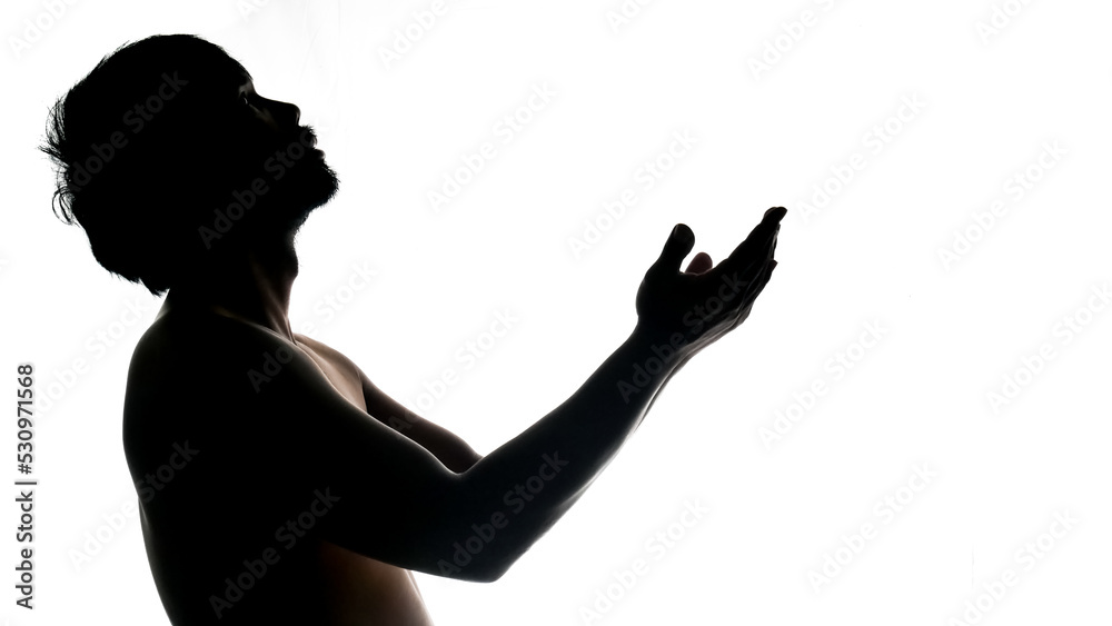 Silhouette of a praying man on a white background. Used in a Thanksgiving project.