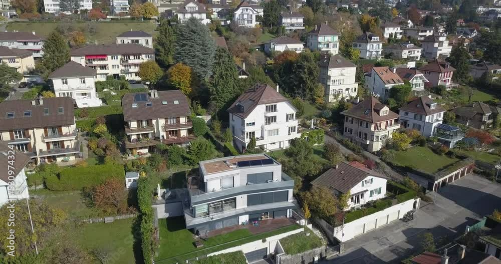 drone panning shot: Lausanne, residential neighborhood in the town, trees and houses, urban environment, Switzerland, Vaud drone panning shot: Lausanne, residential neighborhood in the town, trees and houses, urban environment, Switzerland, Vaud