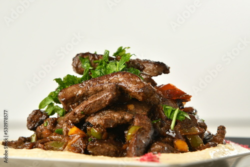 beef liver, served dry or with curry in a bowl, karahi or plate
