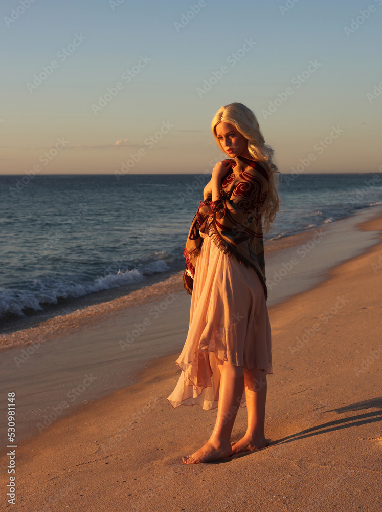full length portrait of beautiful young woman with long hair wearing ...