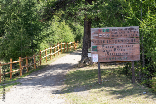 tourist billboard on the Wood of Salbertrand. Alps of Piedmont, Susa Valley, Sauze d’Oulx