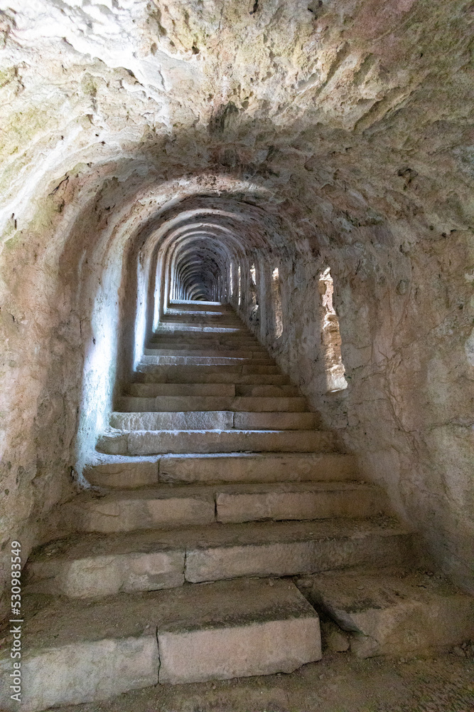 Obraz premium Metropolitan City of Turin, Piedmont, northern Italy - August 19 2022: Indoor royal staircase, 4000 steps, in Fenestrelle Fort, the biggest alpine fortification in Europe.