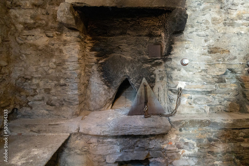 Old wood-fired oven for baking bread from the whole community of Usseaux,  the village of Occitan culture in Piedmont in northern Italy photo