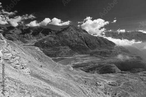 black and white view Lake Montcenis (Moncenisio) on the border between Italy and France in the Alps mountains