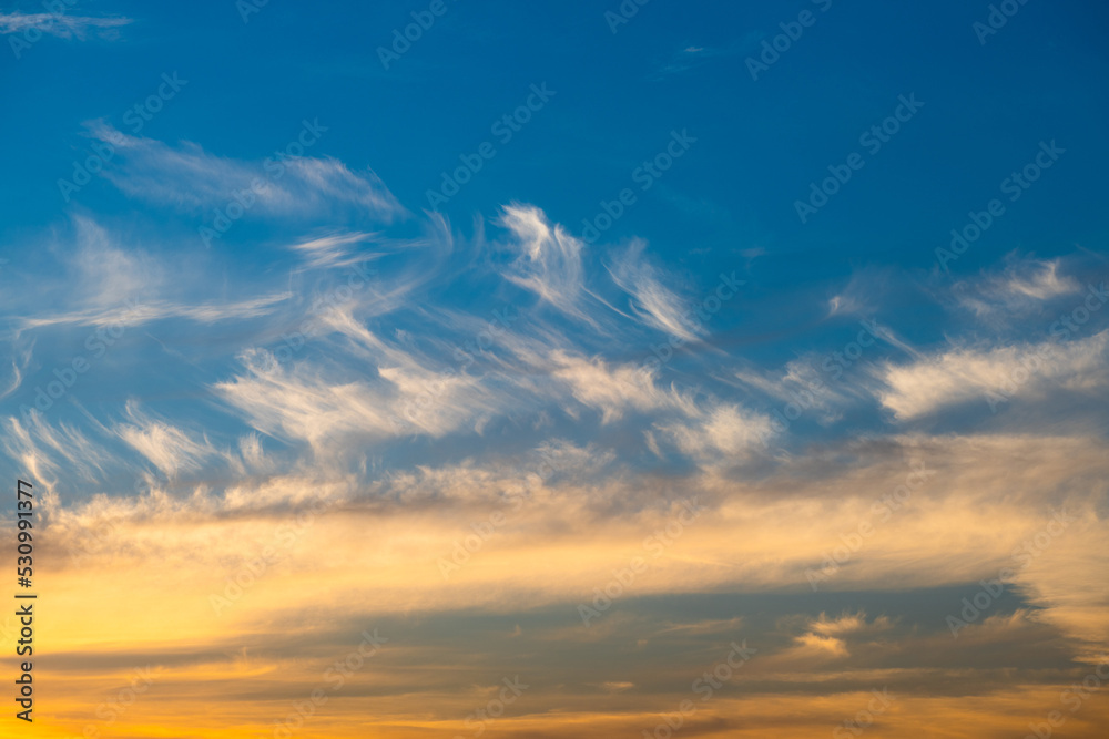 Beautiful yellow clouds in the blue sunset sky