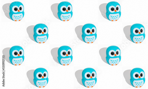owl figurine pattern on white background. little blue owls isolated. Kids background, blogger or textile print