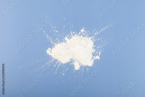 Titanium dioxide powder. TiO2 also known as titanium (IV) oxide or titania. Food additive, E171.  Inorganic compound, white chemical alimentary pigment photo